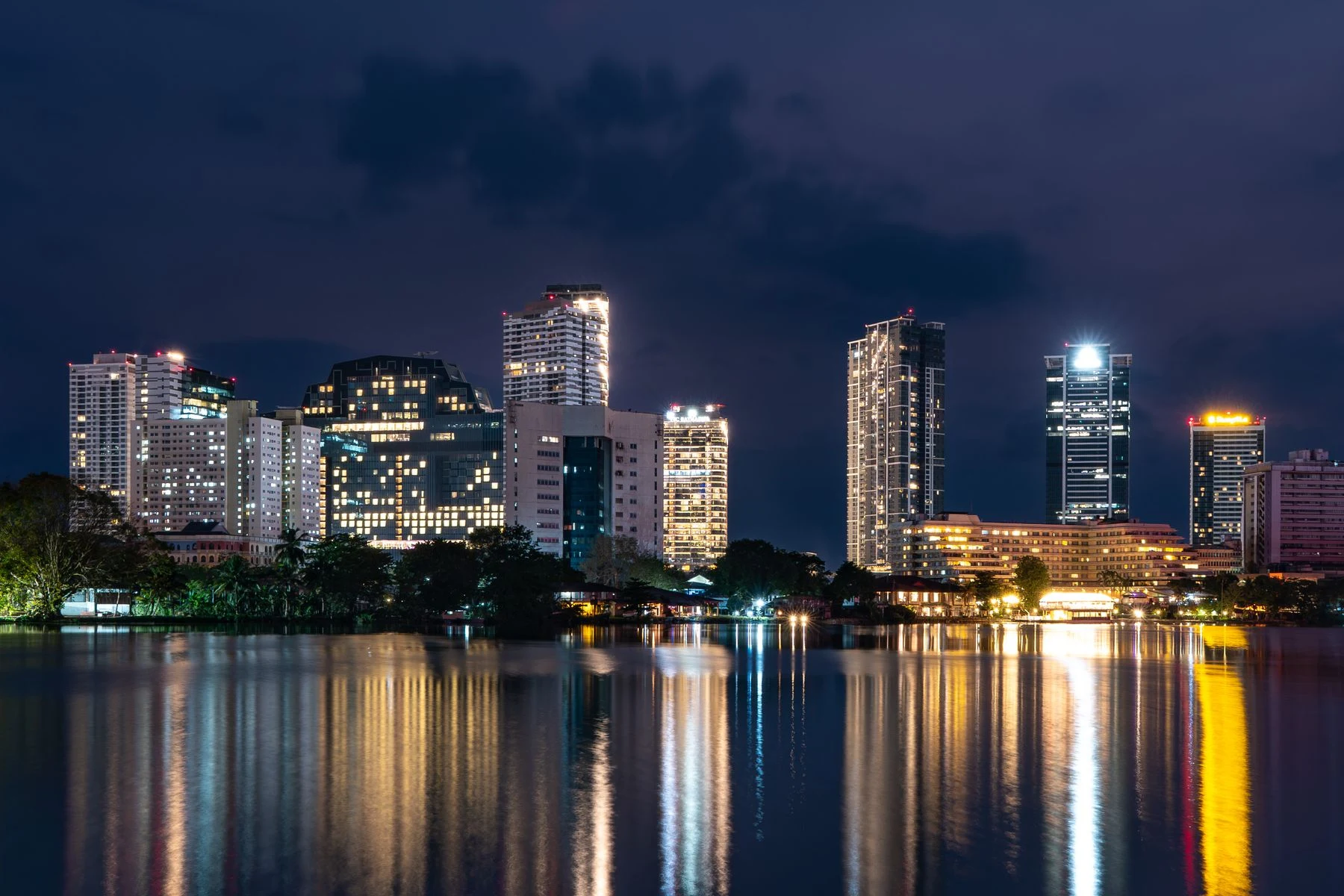 Colombo skyline reflected in Beira Lake at night